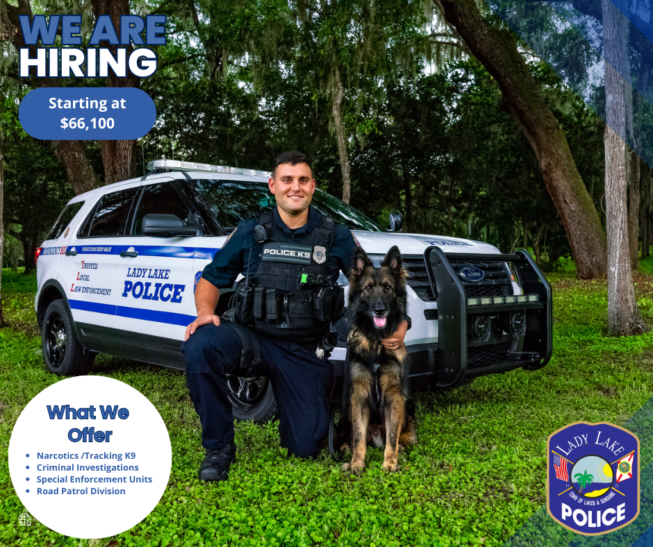 Lady Lake Recruitment Flyer: Officer is kneeling with his service animal with service vehicle behind him. Lady Lake Offers Narcotics/Tracking K9, Criminal Investigations, Special Enforcement Units, and Road Patrols. The starting pay is $66,100.